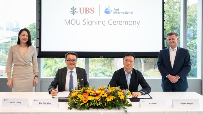 UBS and Ant International collaborating on blockchain-based real-time cross-border settlement and liquidity management.